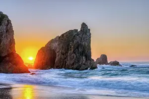 Surf: Beautiful sunset on a rocky beach on the Atlanti