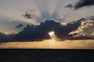 Rays: Belize, Belize City. Sunset, with a hole