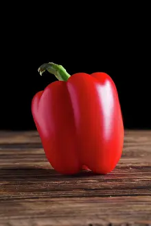 Pepper: Bell pepper on wooden board