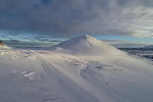 Vesturland: Berserkjahraun, snow covered lava field with crater
