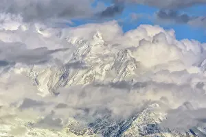 Savoie: Bionnassay needle under clouds at dusk on a stormy
