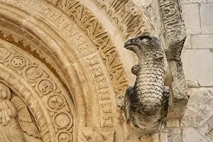 Journey: Bird's head above the portal of the church of Santa Maria Maggiore in Monte Sant'Angelo