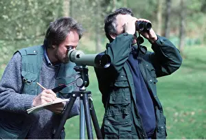 Hobbies: Birdwatchers - looking through telescope