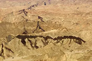 Dyke: Black dolerite dykes clearly visible as they cut