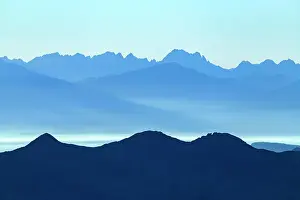 Tyrolean: Blue hour over South Tyrolean mountains with haze