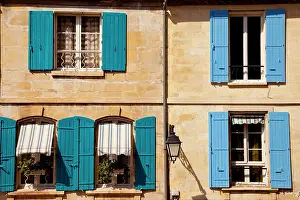 Shutter: Blue shutters along wall of home in old