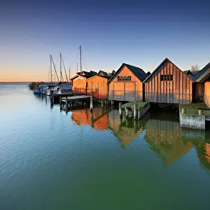 Boathouse: Boat houses in the harbour at Saaler Bodden, morning