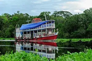 Mamiraua: boat on Solimoes River, flooded forest, Amazon