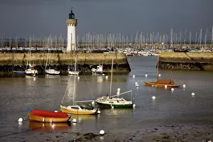 Yachts: Boats in harbour with lighthouse