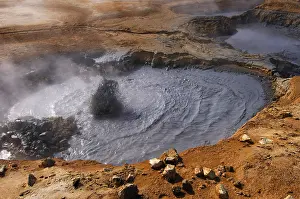 Power: Boiling mud-pool in a geothermal landscape at Hverarond