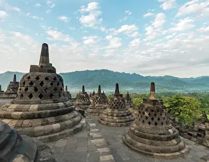 Java: Borobudur Temple Complex, cloudy sky, stupas, Borobudur