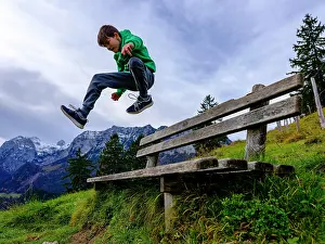 Jack: Boy, 11, jumps over a wooden bench, in the background the Re