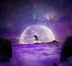 Cyclist: Boy with angel wings balance on a wire over a chasm