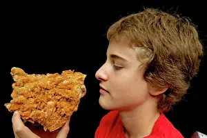 Teenagers: Boy holding Selenite specimen