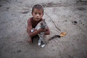 Seat: Boy playing with a cat - Amapa Brazil Amazon