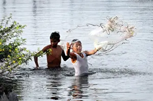 Population: Boys fishing in Lake Nicaragua, San Jorge, Nicaragua