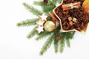 Biscuit: Branches of fir with a Christmas tree bauble, cinnamon
