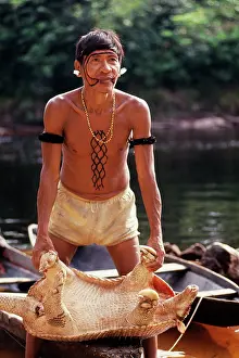 Kill: Brazil - Yanomami Indian hunter with giant armadillo kill