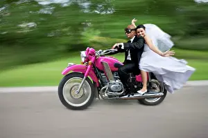 Celebrations: Bridal couple travelling on a motorbike