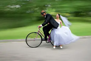 Cycles: Bride and groom, bridal couple riding a bicycle