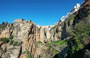 Ronda: Bridge Puente Nuevo with waterfall at steep cliffs