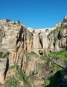Ronda: Bridge Puente Nuevo with waterfall at steep cliffs