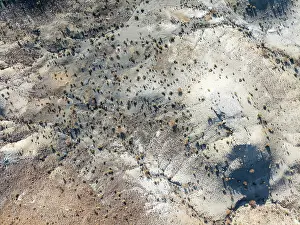 Eroded: Broken, rocky ground with sparse vegetation