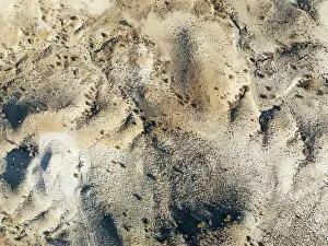 Eroded: Broken, rocky ground with sparse vegetation