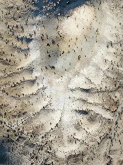 Eroded: Broken, rocky ground with sparse vegetation