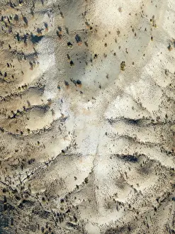 Eroded: Broken, rocky ground with sparse vegetation