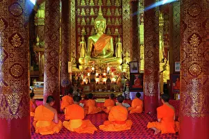 300517: Buddhist monks at worship in Wat Sen temple in Luang Pra