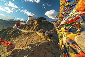 Peaks: Buddhist Prayer flags connecting two peaks of Peak