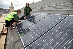Listed: Builders installlation solar PV panels on slate