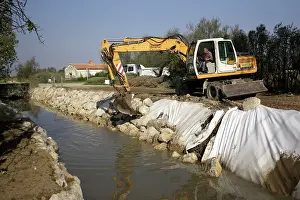 Bulldozer: Bulldozer making alterations - cleaning of a stream