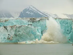 Calving: Calving glacier - ice breaking off into the sea