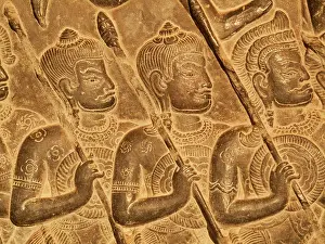 Khmer: Cambodia - Bas-reliefs of warriors at the west