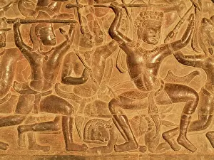 Khmer: Cambodia - Bas-reliefs of warriors at the west