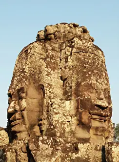 Lord: Cambodia - A Prasat (pyramid tower) with the faces