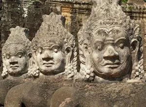 Access: Cambodia - Row of demons along the access road