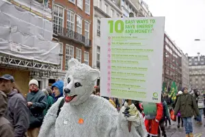 Protest: Campaigner in bear costume with Energy Saving banner