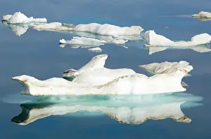 Breaking: Canada, Nunavut. Ice floes cruising Foxe