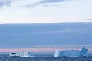 Breaking: Canada, Nunavut. Icebergs at sunset in Davis