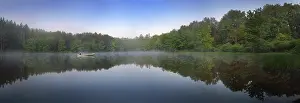 Paddle: Canoist on small lake at sunrise, Delaware