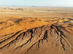 Gorge: Canyon, sand dunes and camelthorn trees (Vachellia erioloba) in the Tsondab Valley in the Namib Desert
