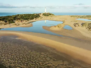 Lighthouse: Cape Trafalgar at the Atlantic Ocean at low tide