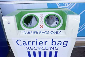 Shops: Carrier bag recycling container outside Tesco food