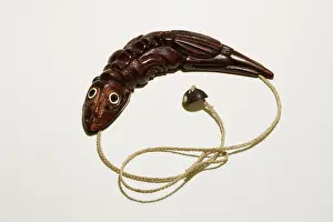 Township: Carved wood pendant of lizard created by craftsman
