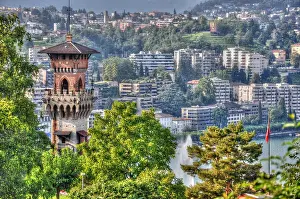 Houses: Castle and houses on the mountain with a lake in