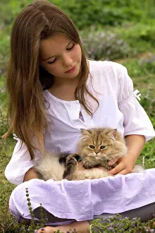 Choosing: Cat - 8 week old kitten sitting on young girl's lap