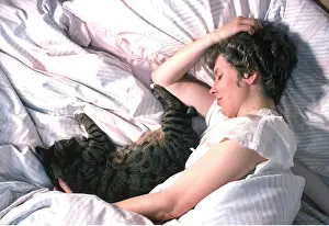 Asleep: CAT - and owner asleep together in bed
